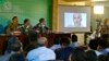 FILE - Journalists look at a photo of Indian national Kulbhushan Jadhav during a press conference in Islamabad, Pakistan, March 29, 2016.