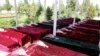 FILE - Coffins containing the bodies of Afghan national army soldiers killed in an April 21 attack on a military base in Mazar-i-Sharif, northern Afghanistan, April 22, 2017. 
