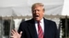 FILE - President Donald Trump speaks to reporters outside the White House, in Washington, Nov. 9, 2019.