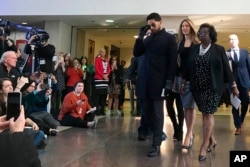 Empire actor Jussie Smollett arrives a news conference after a hearing at the Leighton Criminal Court Building in Chicago, March 26, 2019.