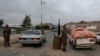 Yemeni soldiers inspect cars at a checkpoin leading to the U.S. embassy in Sanaa, Yemen, Aug. 4, 2013, one of 21 U.S. diplomatic missions Washington ordered closed for the weekend due to threat of an al-Qaida attack.