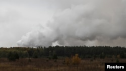 Smoke rises after a fire and explosions hit the Ukrainian defense ministry ammunition depot in the eastern Chernihiv region, Ukraine October 9, 2018.