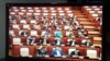 FILE: A television screen showing members of the parliament voted to adopt the proposed amendment to the law on the terms of public officials at legislative institutions, at the National Assembly in Phnom Penh, on Friday, April 7, 2017. (Ith Sothoeuth/VOA Khmer) 