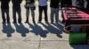 FILE - Suspected members of Sinaloa drug cartel and weapons are presented to the media in Tijuana, Mexico, Jan. 20, 2011. The Mexican National Guard on Nov. 22, 2023, captured Nestor Isidro Perez Salas, who is accused of heading security for a Sinaloa faction. 