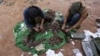 Rebel fighters arrange shells on the outskirts of the northern Syrian town of al-Bab, Syria, Jan. 26, 2017.