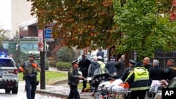 First responders are seen at the Tree of Life Synagogue where a shooter opened fire, In Pittsburgh, Pennsylvania, Oct. 27, 2018, causing multiple casualties.