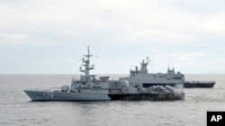 A Royal Malaysian Navy's missile corvette and an offshore patrol vessel in Straits of Malacca, Malaysia, March 13, 2014.