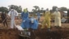 Volunteers and Congolese security officers dig in search for bodies of residents killed in an attack by suspected Islamist rebels at Masala, Democratic Republic of Congo, June 9, 2024. Authorities say the rebels struck again on June 13, killing at least 42 people.