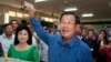 Cambodian Prime Minister Hun Sen of the Cambodian People's Party shows off his ballot paper next to his wife, Bun Rany, foreground left, before voting in local elections at Takhmau polling station in Kandal province, southeast of Phnom Penh, Cambodia, Sunday, June 4, 2017. (AP Photo/Heng Sinith)