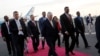 Ethiopia's Minister of Foreign Affairs Workneh Gebeyehu (center R) walks the red carpet with U.S. Secretary of State Rex Tillerson as he arrives to begin a six-day trip in Africa, landing at Addis Ababa International Airport in Addis Ababa, March 7, 2018.