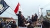 Indonesia Morowali Industrial Park (IMIP) workers protest against their working conditions outside the facility in Bungku, South Sulawesi, on Dec. 27, 2023, after at least 18 people were killed by an explosion at the Chinese-funded nickel-processing plant.