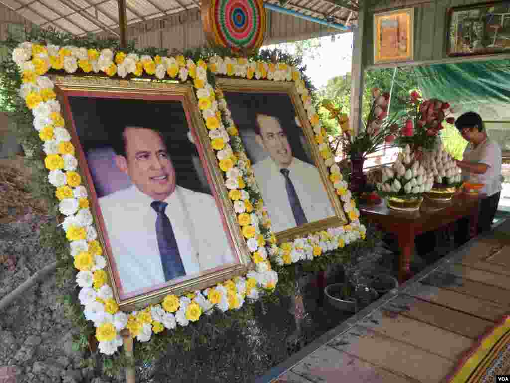 Two side-by-side portraits of social analyst Kem Ley are on display at his hometown in Takeo province, Cambodia, July 02, 2017. (Hul Reaksmey/VOA Khmer)