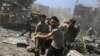 FILE - Men transport a casualty after what activists said were airstrikes by forces loyal to Syria's President Bashar al-Assad on a busy marketplace in Douma, near Damascus, Syria, Aug. 12, 2015. 