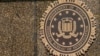 FILE - The seal on the J. Edgar Hoover FBI Building is seen in Washington. A man who worked for the U.S. government has been charged with leaking classified information assessing Israel's earlier plans to attack Iran, according to court papers filed on Nov. 13, 2024. 