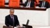 FILE - Turkey's Deputy Prime Minister Bulent Arinc addresses the Turkish Parliament in Ankara in a 2013 photo.