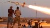 Fighters of Libyan forces allied with the U.N.-backed government fire a rocket at Islamic State fighters in Sirte, Libya, Aug. 4, 2016. 