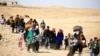 Displaced people flee Islamic State militants in Mosul, Iraq, Nov. 22, 2016. With thousands of civilians believed to be trapped inside Mosul, many observers fear that a retreating IS will turn to chemical weapons while little has been done to prepare or protect residents. 