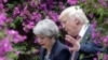 U.S. President Donald Trump, right, talks with British Prime Minister Theresa May in Taormina, Italy, May 26, 2017. 
