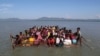 FILE - Rohingya refugees cross the Naf River to reach Bangladesh at Sabrang near Teknaf, Bangladesh, Nov. 10, 2017.