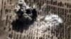 FILE - An image taken from video footage made available on the Russian Defense Ministry's official website purports to show an explosion after airstrikes carried out by Russian air force on what Moscow says was an Islamic State facility in the Syrian province of Idlib, Oct. 15, 2015.