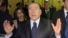 Former Italian Premier Silvio Berlusconi speaks to reporters after a hearing in his Mediaset appeals trial, at Milan's court, Italy, Mar. 1, 2013.