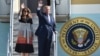 U.S. President Donald Trump and first lady Melania wave as they arrive at Yokota Air Base at Fussa in Tokyo, Nov. 5, 2017.