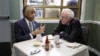 The Rev. Al Sharpton (l) talks with Democratic presidential candidate Sen. Bernie Sanders, as they sit down for a breakfast meeting at Sylvia's Restaurant, Feb. 10, 2016, in the Harlem neighborhood of New York. 