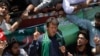 Imran Khan, Pakistani cricketer-turned-politician and chairman of political party Pakistan Tehreek-e-Insaf (PTI), addresses his supporters after his visit to the mausoleum of Mohammad Ali Jinnah, founder and first governor-general of Pakistan, during an e