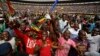 Supporters dance and run on the field after Zimbabwe's President Emmerson Mnangagwa was sworn in at the presidential inauguration ceremony in the capital Harare, Zimbabwe, Nov. 24, 2017.