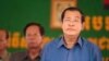 FILE: Cambodia's Prime Minister Hun Sen, right, prepares to deliver a speech during a factory visit outside of Phnom Penh, Cambodia, Aug. 30, 2017.