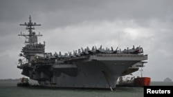 The USS George H.W. Bush aircraft carrier is seen anchored off Stokes Bay in the Solent, Britain, July 27, 2017. 