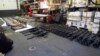 A cache of weapons is assembled on the deck of the guided-missile destroyer USS Gravely (DDG 107). The weapons were seized from a stateless dhow which was intercepted by the Coastal Patrol ship USS Sirocco on March 28. 