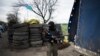 A pro-Russia gunman is seen at a checkpoint, after a shootout near Slovyansk, eastern Ukraine, April 20, 2014.