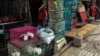 This photo taken on April 16, 2019 shows a shopkeeper opening her shop which sells wildlife and animal products in Panghsang in eastern Shan State, Myanmar. 