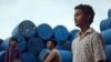Screenshot shows actor Sarm Heng as rural Cambodian boy Chakra in the film, "Buoyancy." (Courtesy: Causeway Films)