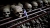 FILE - In this Sept. 27, 2009 photo, skulls and bones from some of the estimated 10,000 Tutsis killed in a two-day massacre at Nyamata church during the 1994 genocide, are displayed in a crypt behind the church, now a memorial to the genocide, in the town