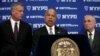U.S. Secretary of Homeland Security Jeh Johnson speaks at a news conference with New York City Mayor Bill de Blasio, left, and New York City Police Commissioner William Bratton in New York City, July 8, 2016, following the shootings of police officers in Dallas.