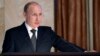 Russian President Vladimir Putin speaks before officials of the Federal Security Service in Moscow, March 26, 2015. 