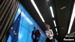 European Council President Charles Michel and European Commission President Ursula von der Leyen leave following a virtual summit with Chinese President Xi Jinping in Brussels, Belgium June 22, 2020.