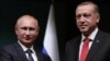 Russian President Vladimir Putin, left, and his Turkish counterpart Recep Tayyip Erdogan shake hands after a joint news conference at the new Presidential Palace in Ankara, Turkey, Dec. 1, 2014. 