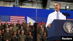 President Barack Obama speaks to military troops at the Fort Bonifacio Gymnasium in Manila, April 29, 2014.