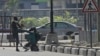 Police officers detain a protester at the Lekki toll gate in Lagos, Nigeria, Wednesday Oct. 21, 2020. 