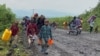 Des civils fuient après des tirs nourris qui ont fait craindre une avancée des rebelles du M23 à Sake près de Goma, le 9 février 2023.