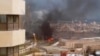 Image from video posted by Libyan blogger shows Corinthia Hotel under attack, Tripoli, Libya, Jan. 27, 2015.