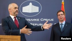 FILE - Albanian Prime Minister Edi Rama, left, and his Serbian counterpart Aleksandar Vucic attend a news conference after their meeting in Belgrade, Serbia, Nov. 10, 2014.