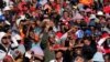 Supporters of South Africa's Economic Freedom Fighters (EFF) listen to their leader Julius Malema during his campaign, ahead of the August 3 local government elections, in Etwatwa, a township near Benoni, South Africa, July 27, 2016. 