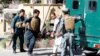 Afghan policemen transport the body of a police after gunmen attack in Jalalabad city eastern Afghanistan, May 17, 2017. 