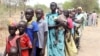 FILE - Residents displaced due to the recent fighting between government and rebel forces in the Upper Nile capital Malakal wait at a World Food Program (WFP) outpost where thousands have taken shelter in Kuernyang Payam, South Sudan, May 2, 2015. 