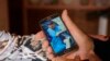FILE - Santiago Sanchez, the father of Santiago Sanchez Cogedor, shows a photo of his son at his home in Henches, Spain, Oct. 24, 2022.