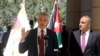 Amman Mayor Yousef Al-Shawarbeh listens to U.N. High Commissioner for Refugees Filippo Grandi as he speaks during the opening of a bazaar to mark World Refugee Day, in Amman, Jordan, June 20, 2019.